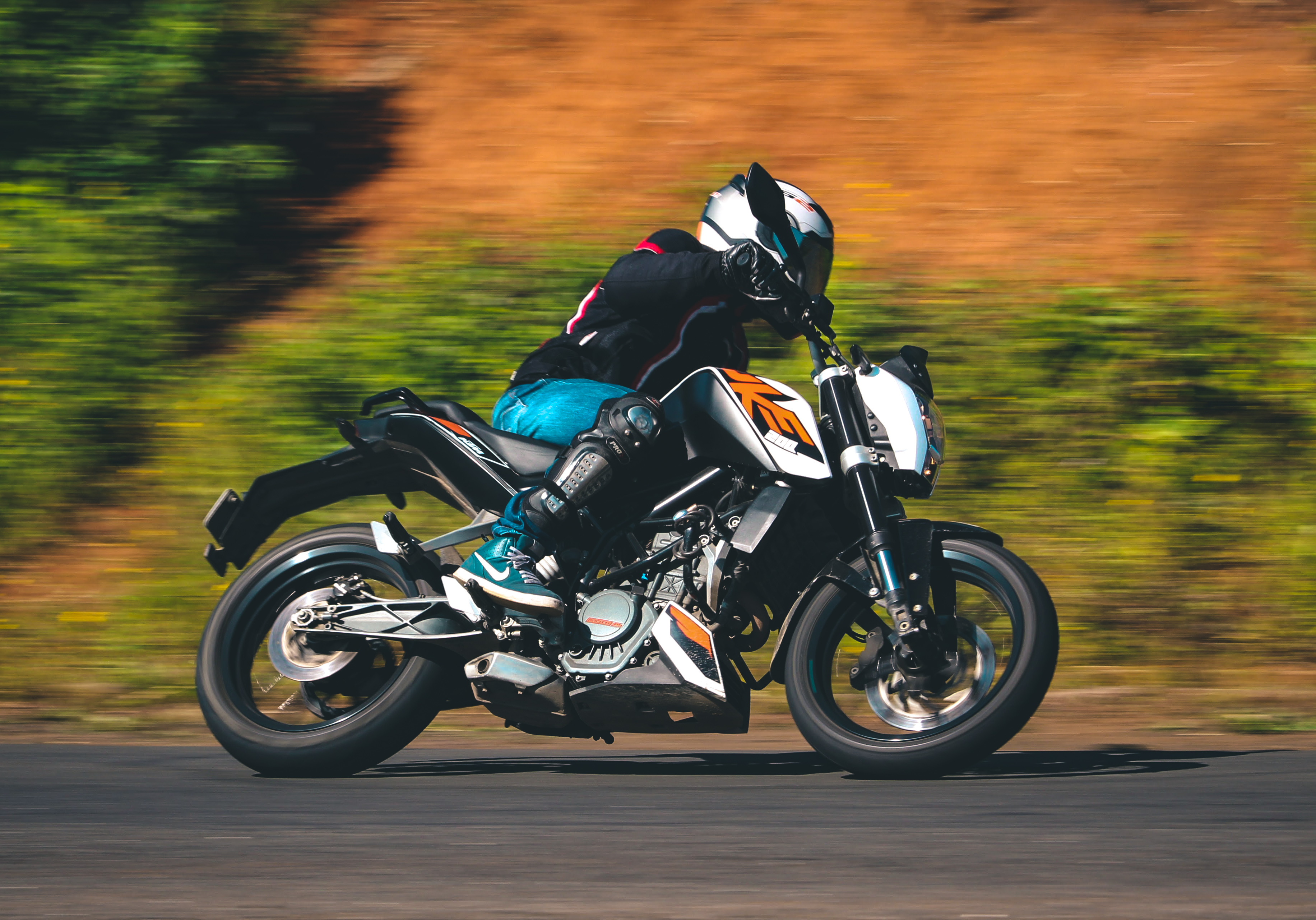 KTM motorcycle captured in dynamic motion — automotive photography